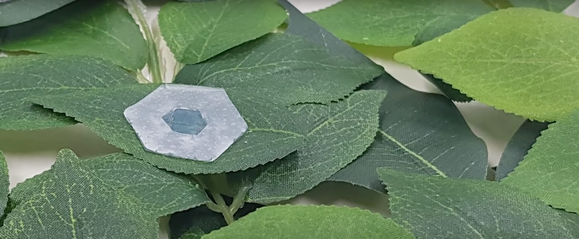 Underwater maneuvering of robotic sheets through buoyancy-mediated active flutter